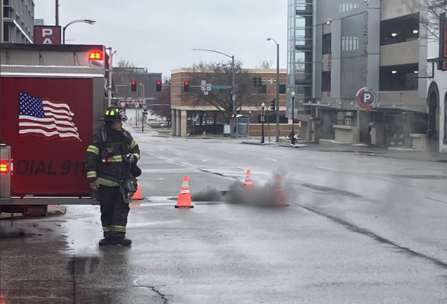 Smoke billows from a downtown Davenport manhole Tuesday afternoon. (Mike Colón)