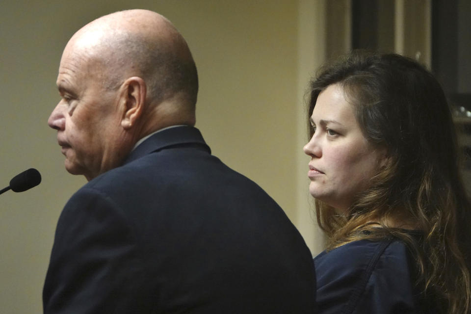 Hannah Roemhild, right, who is accused of driving through checkpoints outside President Donald Trump's Florida home Mar-a-Lago, listens during her initial appearance hearing, Monday, Feb. 3, 2020, West Palm Beach, Fla. (Joe Cavaretta/South Florida Sun-Sentinel via AP)