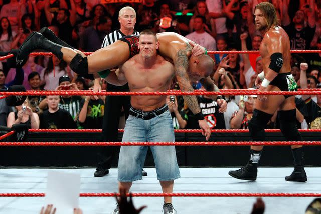 Ethan Miller/Getty Images John Cena delivers the Attitude Adjustment to Randy Orton