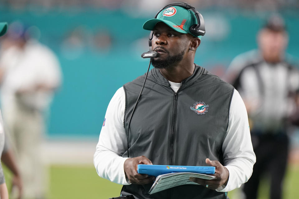 FILE - Miami Dolphins head coach Brian Flores stands on the sideline during the second half of an NFL football game against the New England Patriots, Jan. 9, 2022, in Miami Gardens, Fla. The Minnesota Vikings have hired Flores as their defensive coordinator. Flores was a senior defensive assistant and linebackers coach this season for Pittsburgh, after three years as head coach in Miami. (AP Photo/Wilfredo Lee, File)