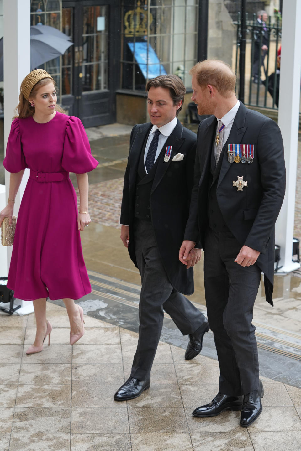 LONDON, ENGLAND - MAY 06: Princess Beatrice and Husband Edoardo Mapelli Mozzi along with Prince Harry, Duke of Sussex arrive ahead of the Coronation of King Charles III and Queen Camilla on May 6, 2023 in London, England. The Coronation of Charles III and his wife, Camilla, as King and Queen of the United Kingdom of Great Britain and Northern Ireland, and the other Commonwealth realms takes place at Westminster Abbey today. Charles acceded to the throne on 8 September 2022, upon the death of his mother, Elizabeth II. (Photo by Dan Charity - WPA Pool/Getty Images)