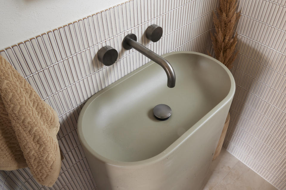 Bathroom sink with finger tiles. 