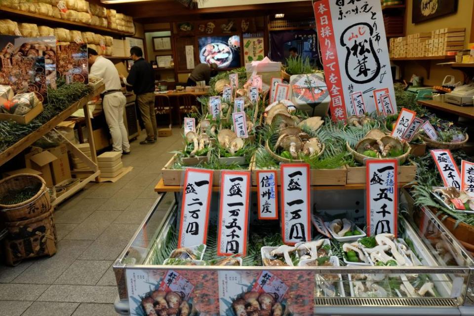 Grocery store in Japan with with a selection of mushrooms and vegetables for delicious stir fry.