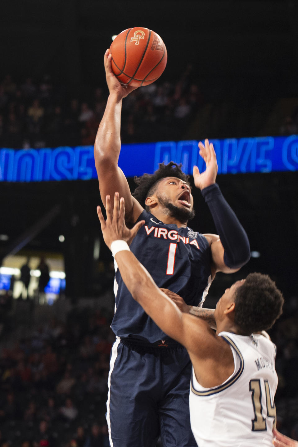 Virginia forward Jayden Gardner shoots over Georgia Tech forward Jalon Moore in the first half of an NCAA college basketball game, Saturday, Dec. 31, 2022, in Atlanta. (AP Photo/Hakim Wright Sr.)