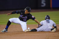 Miami Marlins' Jon Berti (5) slides past New York Mets' Francisco Lindor (12) to steal second base during the sixth inning of a baseball game Friday, June 17, 2022, in New York. (AP Photo/Frank Franklin II)