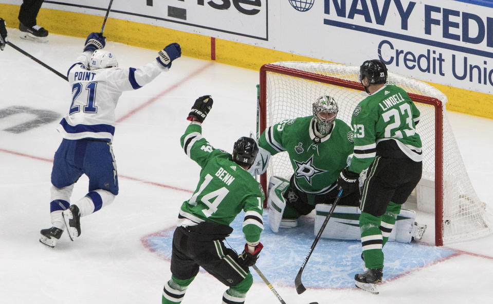 Tampa Bay Lightning center Brayden Point (21) celebrates after he scored on Dallas Stars goaltender Anton Khudobin (35) during the second period of Game 4 of the NHL hockey Stanley Cup Final, Friday, Sept. 25, 2020, in Edmonton, Alberta. (Jason Franson/The Canadian Press via AP)