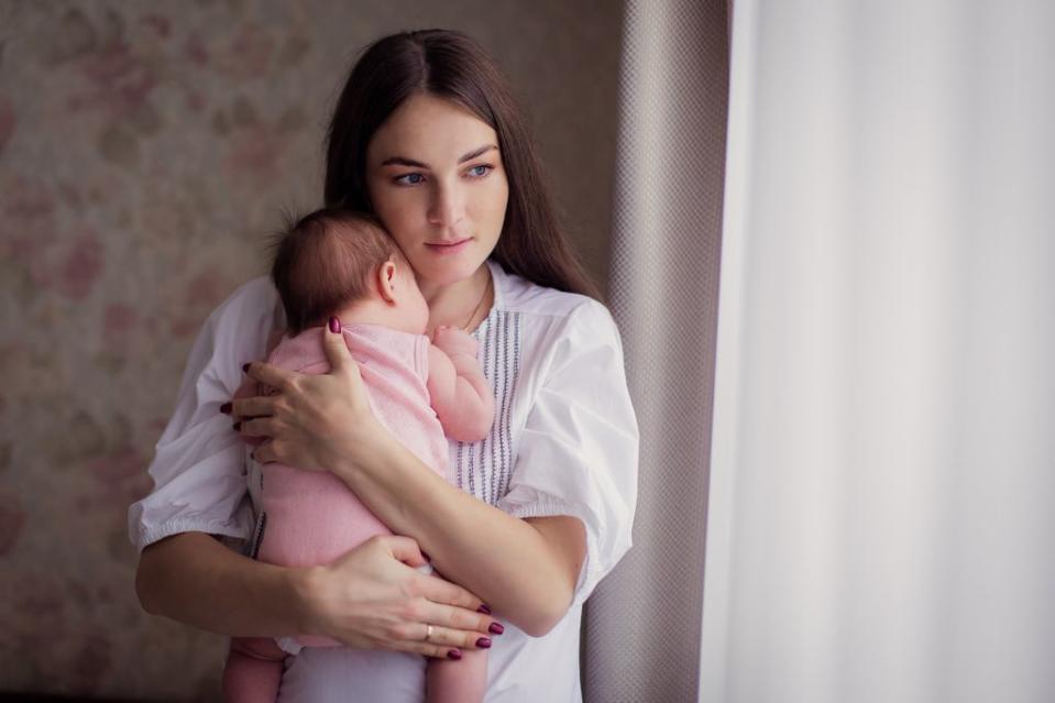 Mother holding her baby