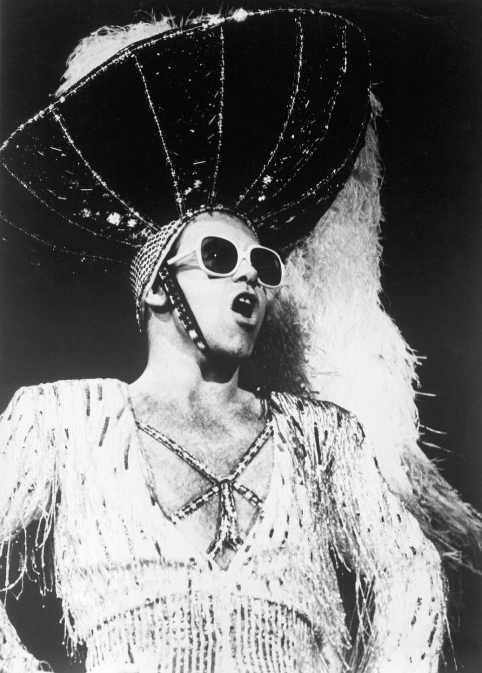 <p>Onstage, wearing a giant fuzzy hat, circa 1974.</p>