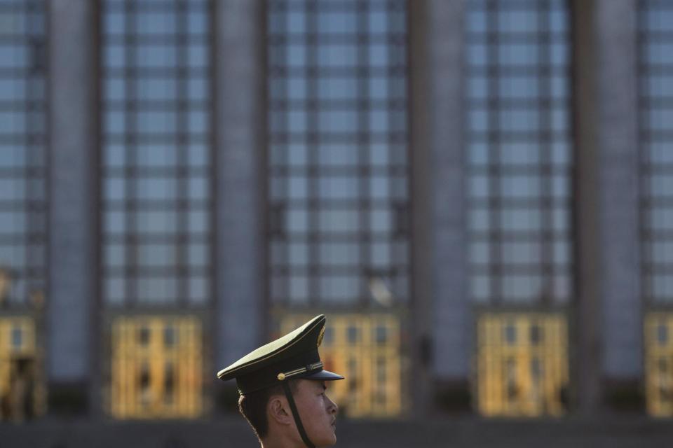 CHANGING SLUG - In this Wednesday, March 8, 2017 photo, a Chinese paramilitary policeman stands on duty in front of the Great Hall of the People in Beijing, China. While the Great Hall of the People buzzes with activity during state events, especially the roughly two-weeks of the legislative session, at other times the hall is strangely quiet, with voices echoing off its marble walls and sentinels standing silently in its forecourt that looks out onto the vast expanse of Tiananmen Square. (AP Photo/Ng Han Guan)