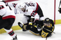 Ottawa Senators' Travis Hamonic (23) and Pittsburgh Penguins' Evgeni Malkin (71) collide during the first period of an NHL hockey game in Pittsburgh, Monday, March 20, 2023. (AP Photo/Gene J. Puskar)