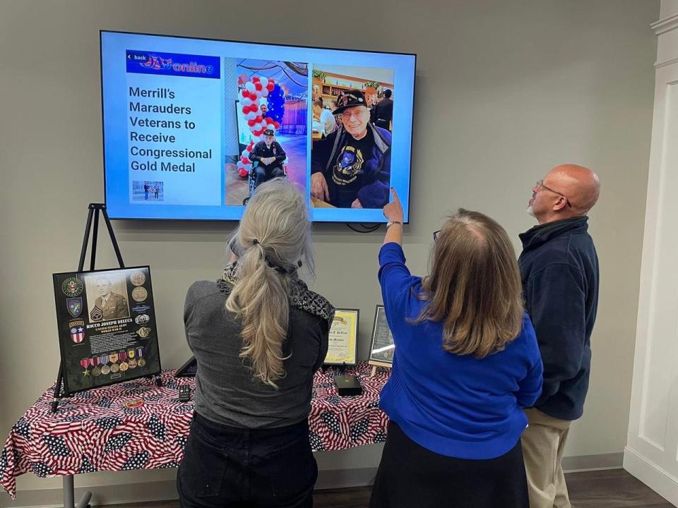 Norwich resident Joyce Horey (middle) tells stories about her late father, U.S. Army Tech. Sgt. Rocco DeLuca, to Ledyard resident Patricia Willis and Norwich resident Tim Bosworth Wednesday. DeLuca posthumously received a Congressional Gold Medal for his service as one of Merrill's Marauders.