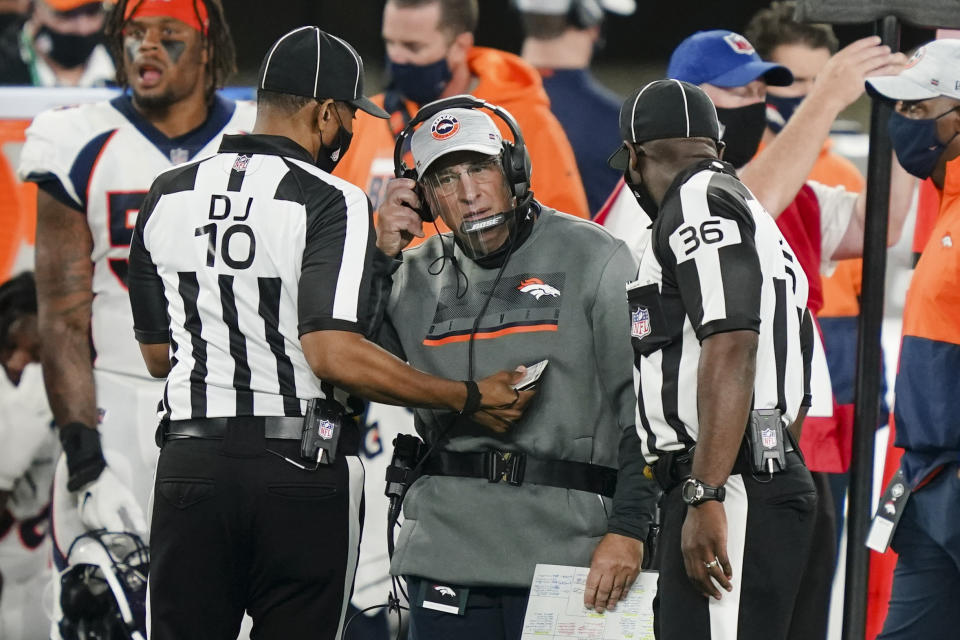 Denver Broncos head coach Vic Fangio talks to officials during the first half of an NFL football game against the New York Jets Thursday, Oct. 1, 2020, in East Rutherford, N.J.Maybe the third time will actually bring a kickoff between for the Denver Broncos and New England Patriots. After having their original Week 5 matchup twice postponed because of a mini outbreak of coronavirus cases on the Patriots that saw four players including quarterback Cam Newton and reigning Defensive Player of the Year Stephon Gilmore test positive, the teams are hopeful they will finally meet this week. (AP Photo/John Minchillo)