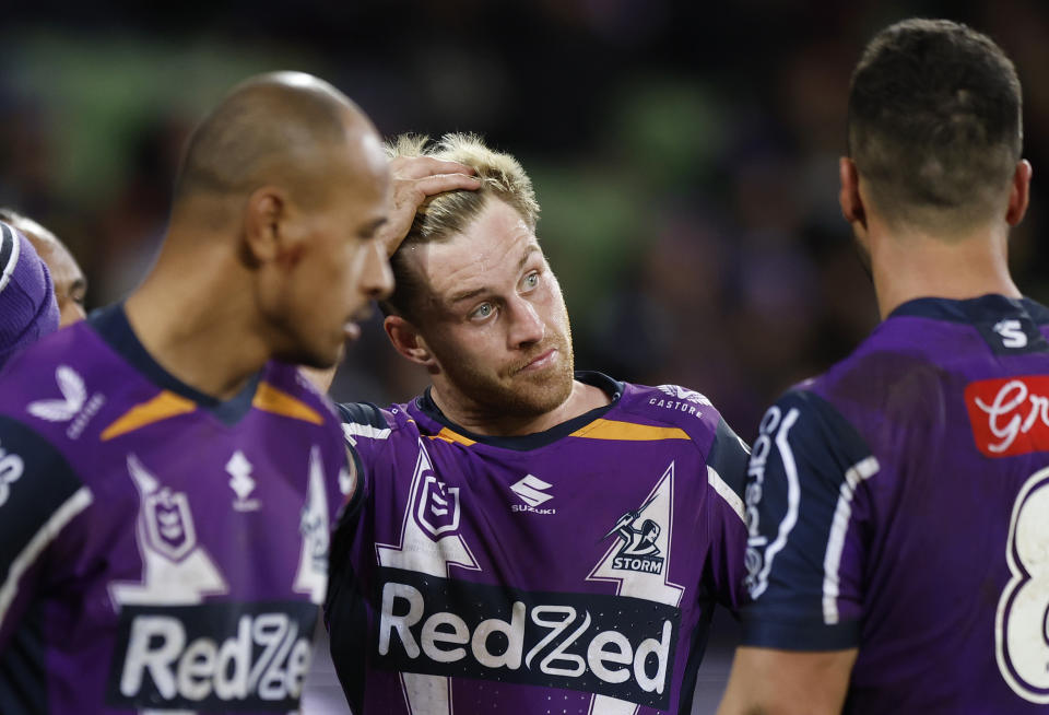 Cameron Munster (pictured) reacts with teammates after the Raiders score against the Storm.