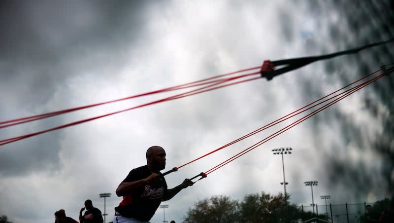 Atlanta Braves pitcher Jose Veras works out with resistance bands during a spring training baseball workout, Monday, Feb. 23, 2015, in Kissimmee, Fla. A single session of high-intensity resistance training can improve memory, according to a study in the journal Brain and Behaviour.