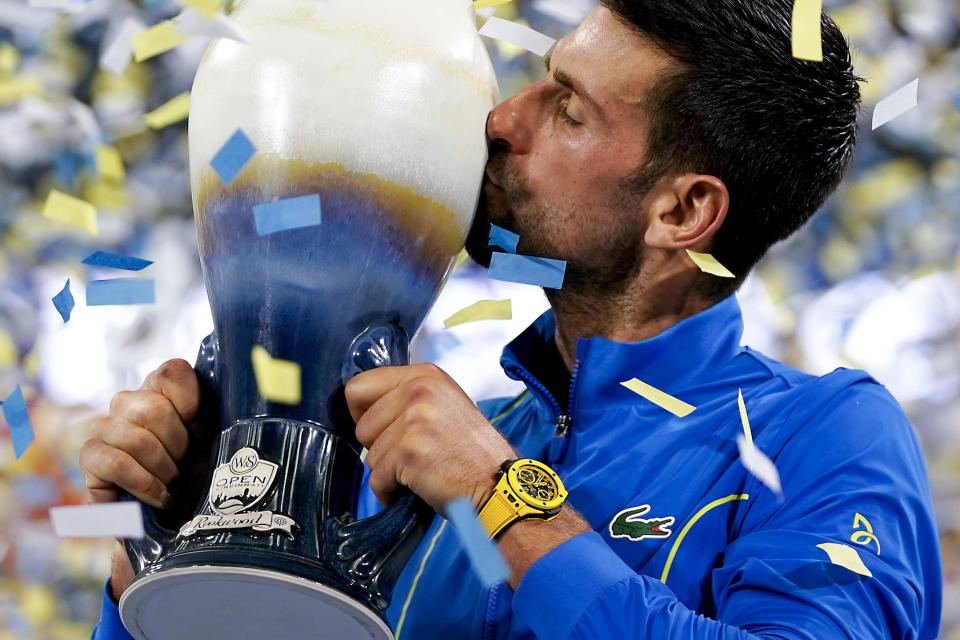 Novak Djokovic, of Serbia, kisses the Rookwood Cup in celebration after defeating Carlos Alcaraz, of Spain, at the conclusion of the men’s singles final of the Western & Southern Open tennis tournament, Sunday, Aug. 20, 2023, at the Lindner Family Tennis Center in Mason, Ohio. Djokovic won, 5-7, 7-6, 7-6.