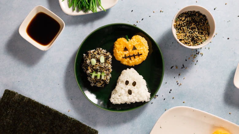 trio of halloween onigiri on plate 