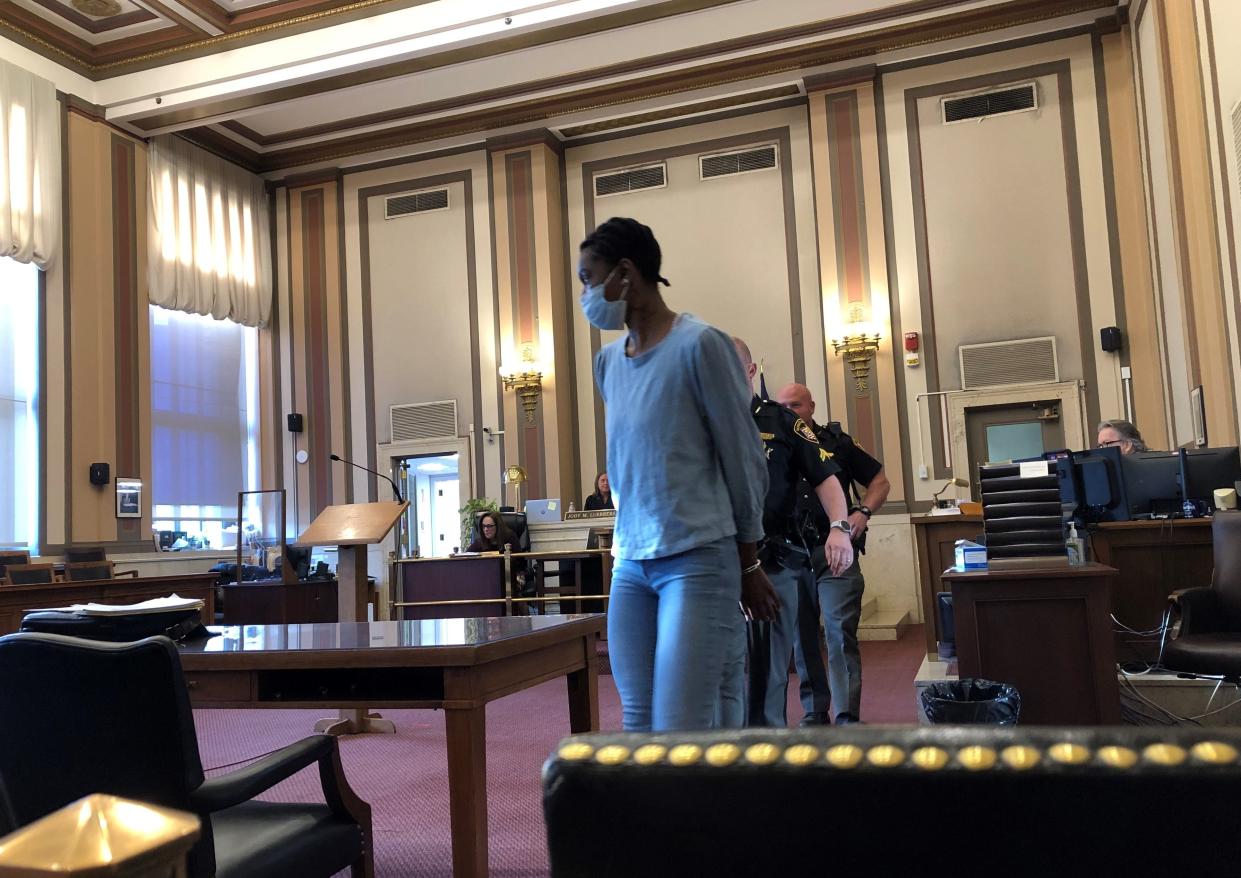 Tianna Robinson is led into Hamilton County Common Pleas Judge Jody Luebbers' courtroom on April 23, 2023 for a competency hearing.