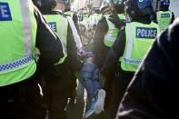 People gather in Trafalgar Square to protest against the lockdown imposed by the government, in London