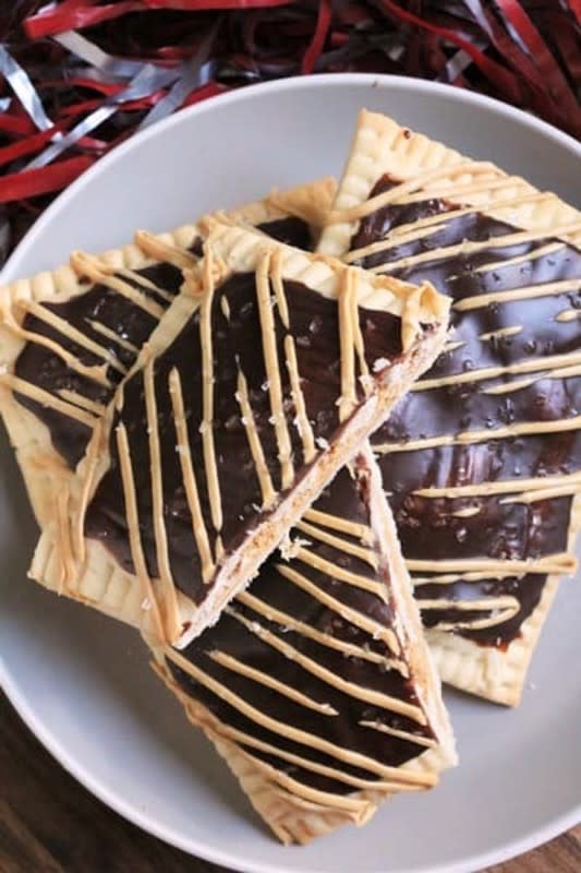 <p>The Spiffy Cookie</p><p>The best thing about homemade pop-tarts? Creating your own flavors! Try this version with peanut butter filling and a chocolate glaze.</p><p><strong>Get the recipe: <a href="https://www.thespiffycookie.com/2020/10/24/peanut-butter-chocolate-glazed-pop-tarts/" rel="nofollow noopener" target="_blank" data-ylk="slk:Peanut Butter and Chocolate-Glazed Pop Tarts;elm:context_link;itc:0;sec:content-canvas" class="link "><em>Peanut Butter and Chocolate-Glazed Pop Tarts</em></a></strong></p>