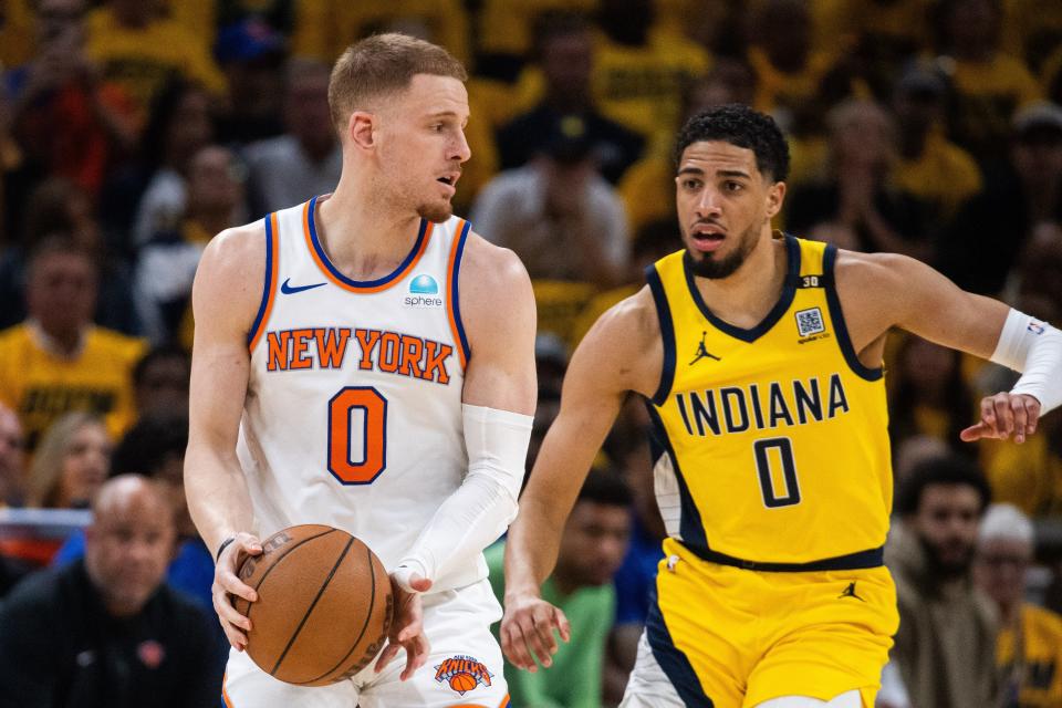 May 10, 2024; Indianapolis, Indiana, USA; New York Knicks guard Donte DiVincenzo (0) holds the ball while Indiana Pacers guard Tyrese Haliburton (0) defends during game three of the second round for the 2024 NBA playoffs at Gainbridge Fieldhouse. Mandatory Credit: Trevor Ruszkowski-USA TODAY Sports