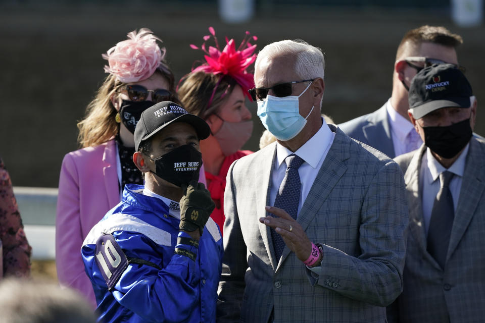 John Velazquez, left, talks with Todd Pletcher after Velazquez rode Malathaat to victory during the 147th running of the Kentucky Oaks at Churchill Downs, Friday, April 30, 2021, in Louisville, Ky. (AP Photo/Jeff Roberson)