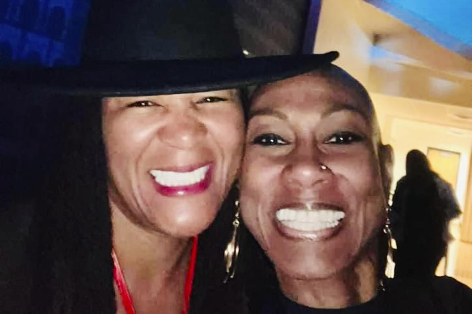 This photo provided by Monica Graham shows Antoinette Bonnie Candia-Bailey, right, as she poses for a selfie with her friend, Graham, in October 2023 during homecoming at Lincoln University in Jefferson City, Mo. Candia-Bailey's suicide on Jan. 8, 2024, led to the president of the historically Black college to agree to be placed on paid leave amid reports that he bullied her. Graduates of the school are demanding that he be terminated. (Monica Graham via AP)