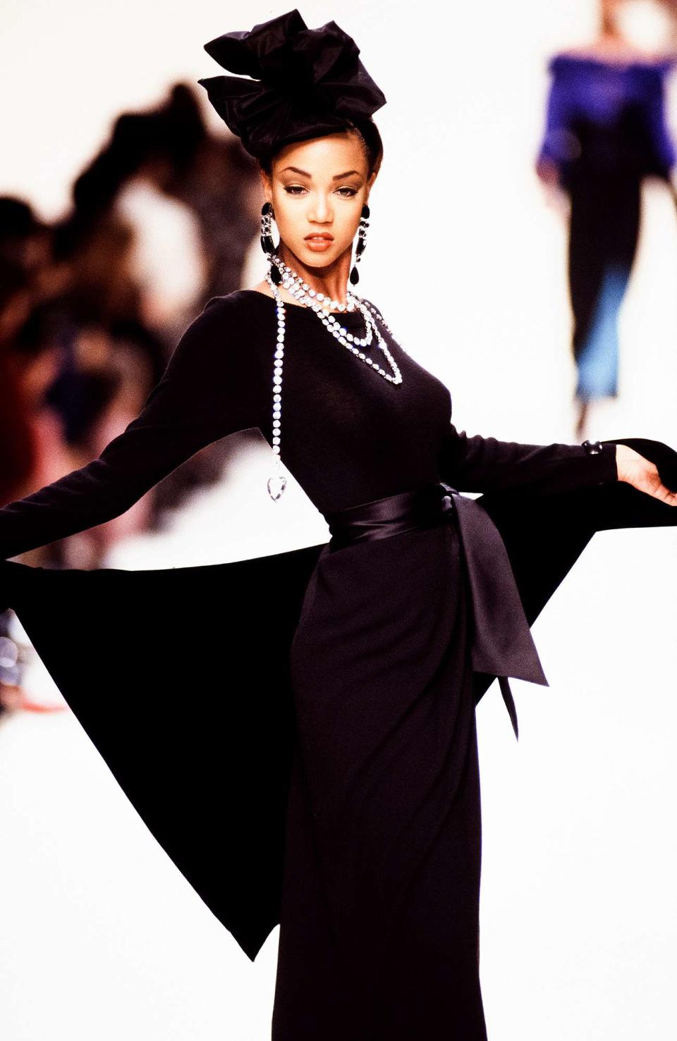 <p>In 1992, she rocked this elegant black look in Yves Saint Laurent's ready-to-wear fall/winter show.</p>