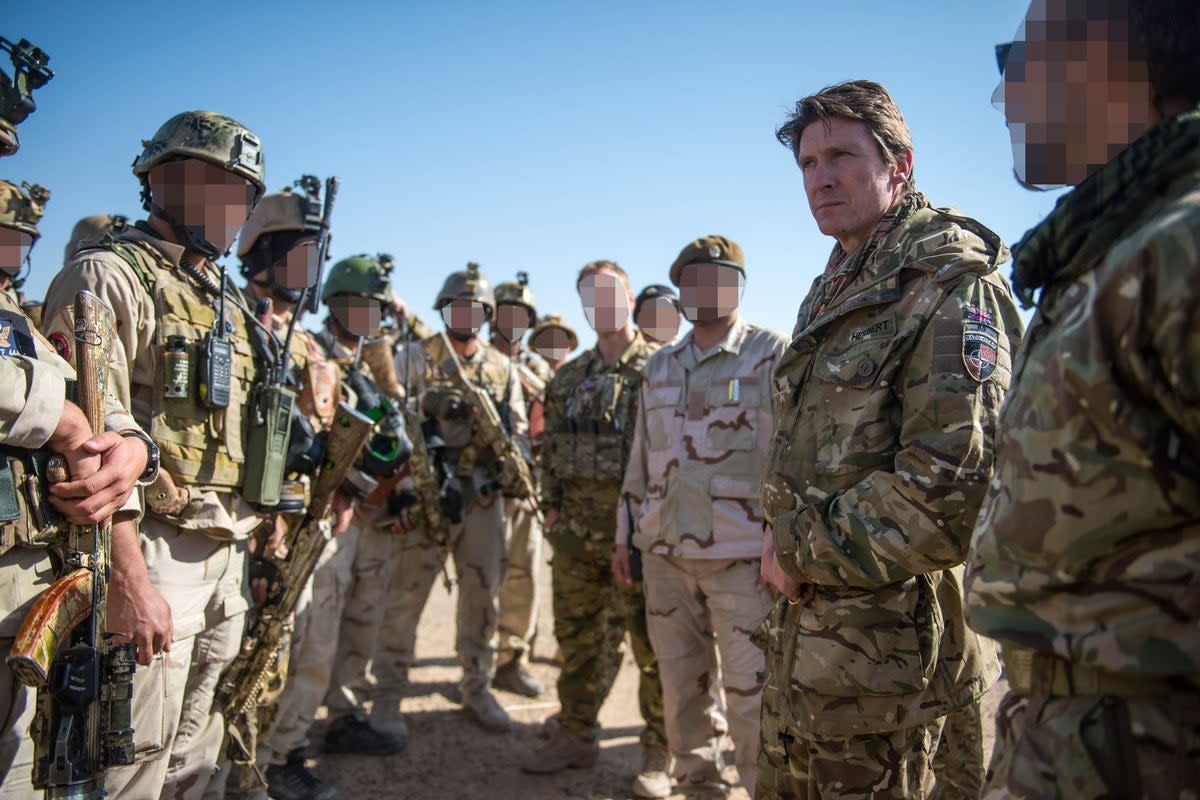 Major General Charlie Herbert (second from right), former senior Nato adviser in Afghanistan, with 444 members in Kandahar in 2018 (Supplied)