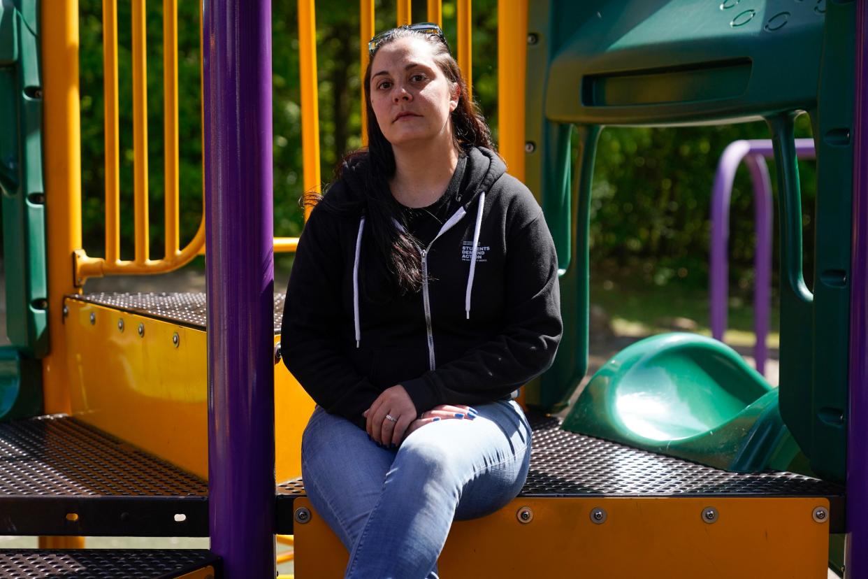 Erica Lafferty, whose mother Dawn Lafferty Hochsprung was killed during the Sandy Hook Elementary School shooting in 2012, poses for a picture on the playground honoring her mother in Watertown, Conn., on May 25, 2022. 