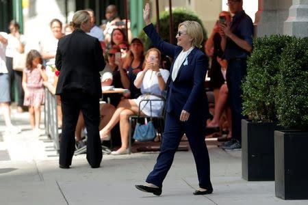 U.S. Democratic presidential candidate Hillary Clinton leaves her daughter Chelsea's home in New York, New York, United States September 11, 2016, after Clinton left ceremonies commemorating the 15th anniversary of the September 11 attacks feeling "overheated." REUTERS/Brian Snyder