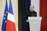 French President Francois Hollande delivers a speech during a ceremony on November 27, 2015 at the Hotel des Invalides to honour the victims of the Paris attacks