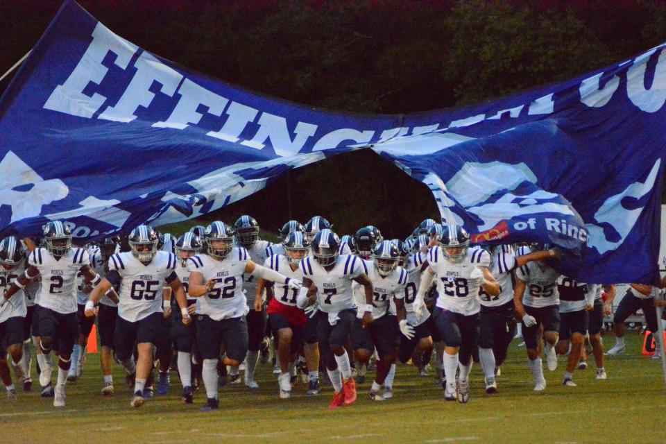 The Effingham County Rebels charge onto the field for their game against Richmond Hill. 