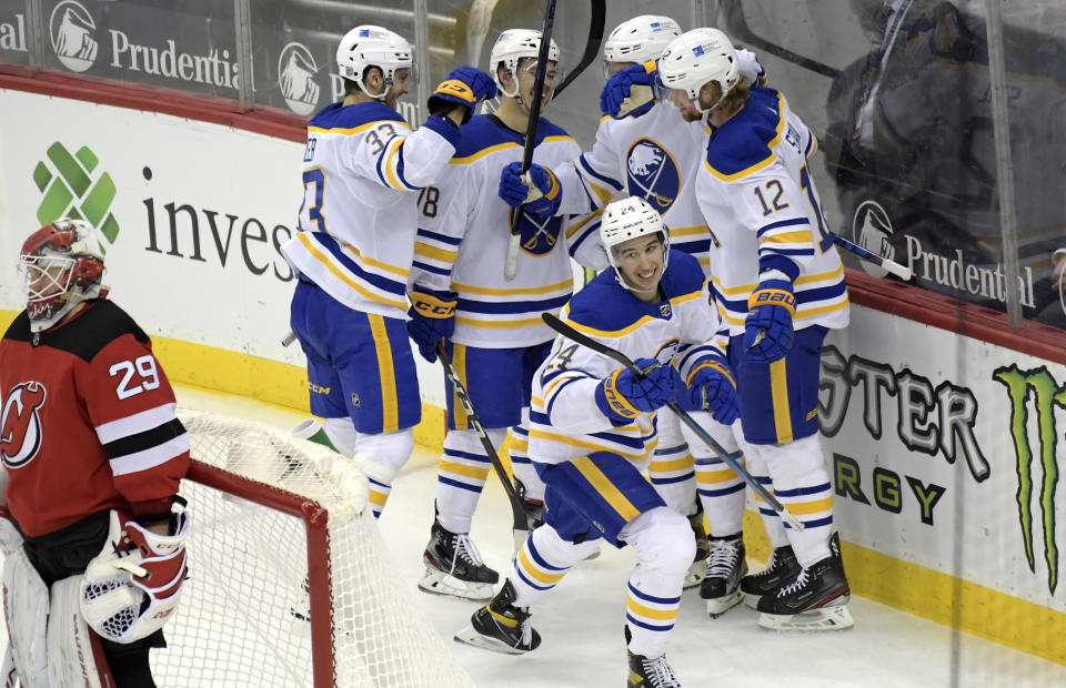 Buffalo Sabres center Dylan Cozens (24)celebrates his goal against New Jersey Devils goaltender Mackenzie Blackwood (29) during the third period of an NHL hockey game Tuesday, Feb. 23, 2021, in Newark, N.J. (AP Photo/Bill Kostroun)