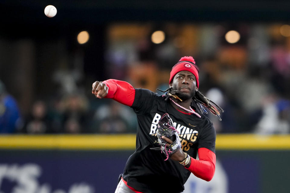 Cincinnati Reds shortstop Elly De La Cruz wears a shirt for Jackie Robinson Day during batting practice before a baseball game against the Seattle Mariners, Monday, April 15, 2024, in Seattle. (AP Photo/Lindsey Wasson)