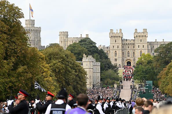 WINDSOR, ENGLAND - SEPTEMBER 19: General view as the mourners watch the State Hearse of Queen Elizabeth II as it drives along the Long Walk ahead of the Committal Service for Queen Elizabeth II on September 19, 2022 in Windsor, England. The committal service at St George's Chapel, Windsor Castle, took place following the state funeral at Westminster Abbey. A private burial in The King George VI Memorial Chapel followed. Queen Elizabeth II died at Balmoral Castle in Scotland on September 8, 2022, and is succeeded by her eldest son, King Charles III. (Photo by Stuart C. Wilson/Getty Images)