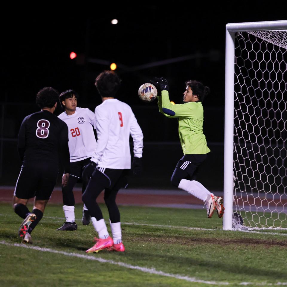 Lincoln goalie Kevin Romero leaps to make the save during a road game against Weston Ranch in Stockton, CA