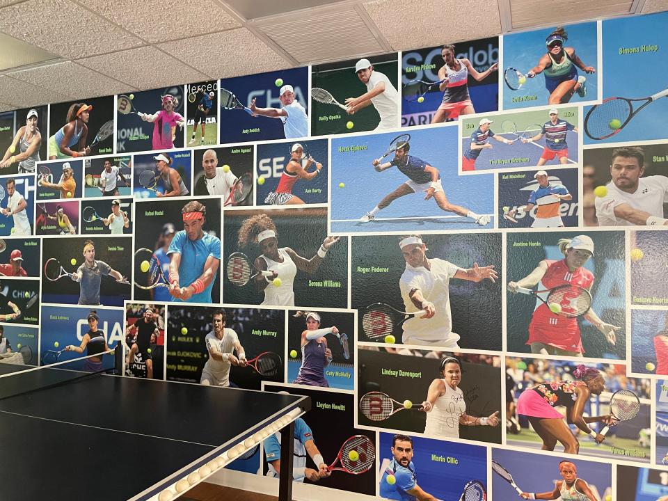 Court Thirteen, the new pro shop/lounge hybrid at Payne Park Tennis Center, is decorated with vintage tennis memorabilia — including a wall covered in pictures of some of the game's greats.