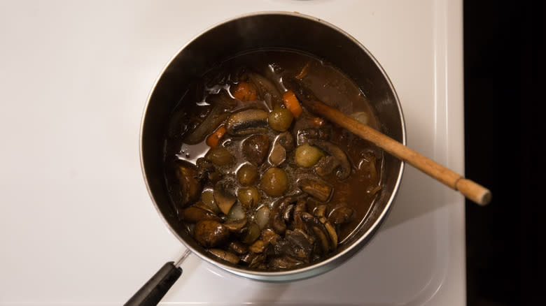 mushroom Bourguignon simmering on stove 