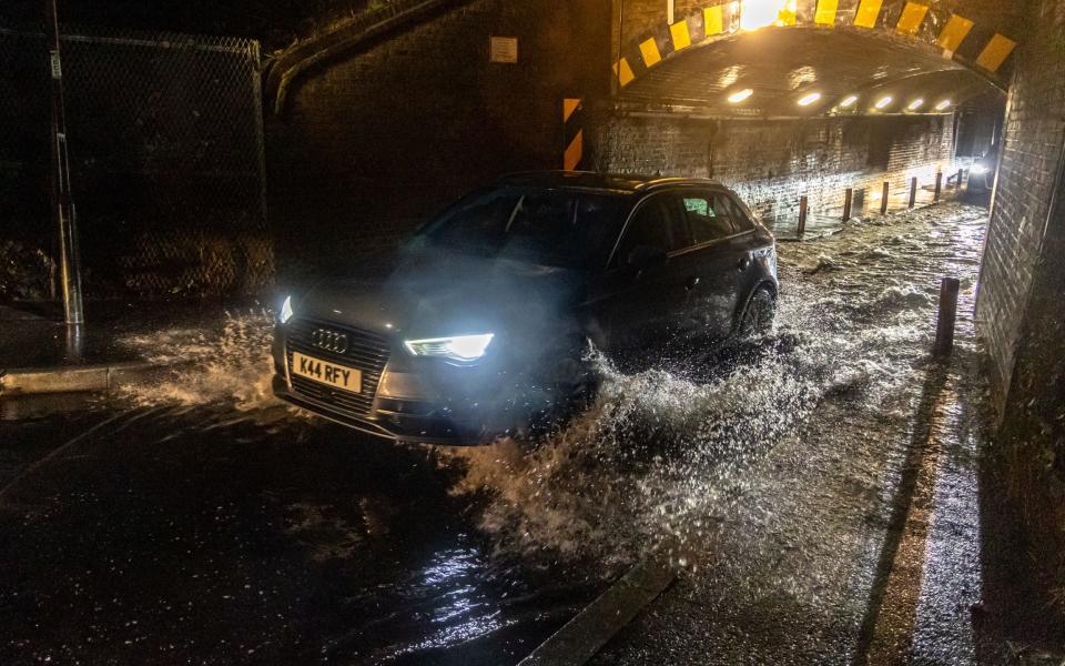 After a night of torrential rain, flooding hits commuters this morning in Wimbledon, south-west London