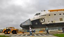 Space Shuttle Endeavour leaves the Orbiter Processing Facility on its way to the Vehicle Assembly Building (VAB) at Kennedy Space Center August 11, 2011 in Cape Canaveral, Florida. Space Shuttles Endeavour and Discovery switched buildings as they are being decommissioned with the end of the Shuttle program. (Photo by Roberto Gonzalez/Getty Images)