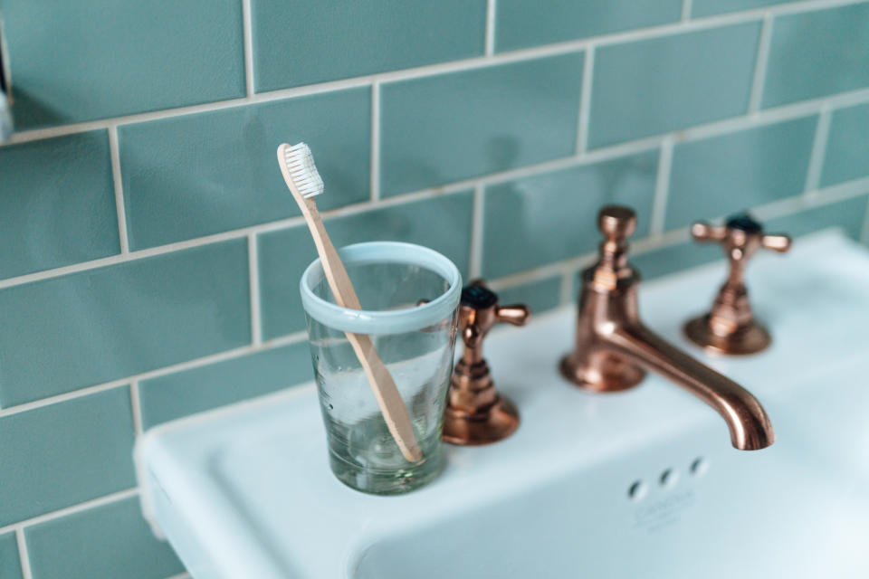 a tooth brush on the sink