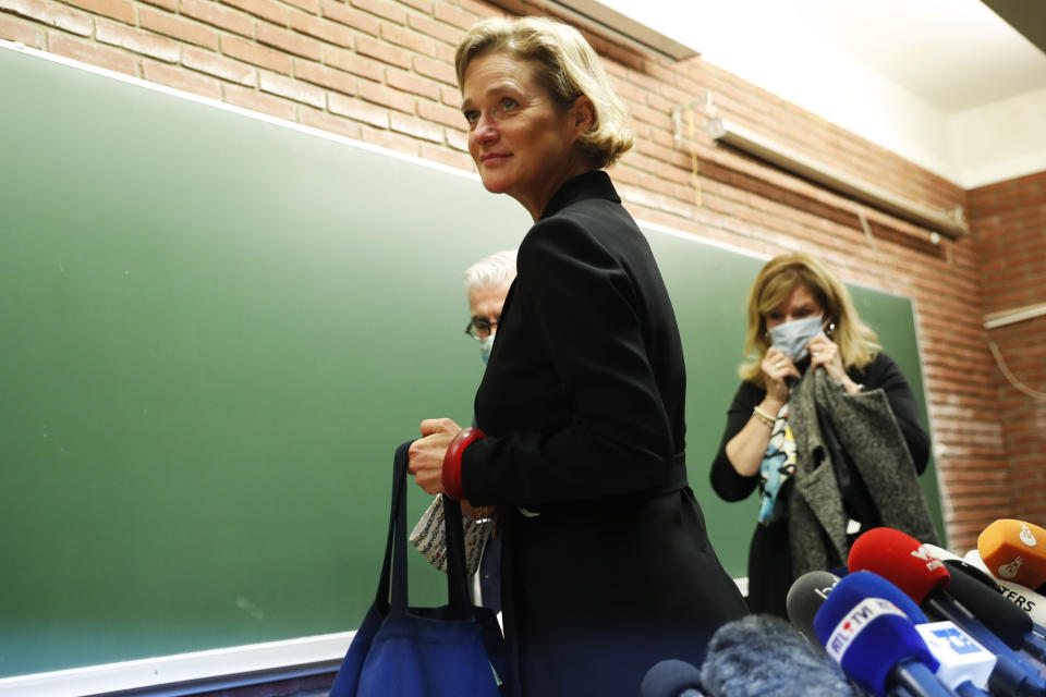 Belgium's artist and sculptor Delphine Boel leaves after a press conference in Brussels, Monday, Oct. 5, 2020. Artist and sculptor Delphine Boel is on the cusp of officially becoming a Belgian princess after a Brussels court on Thursday, Oct. 1, 2020 ruled in her favor in a decades-old royal paternity scandal pitting her against former King Albert II. (AP Photo/Francisco Seco)