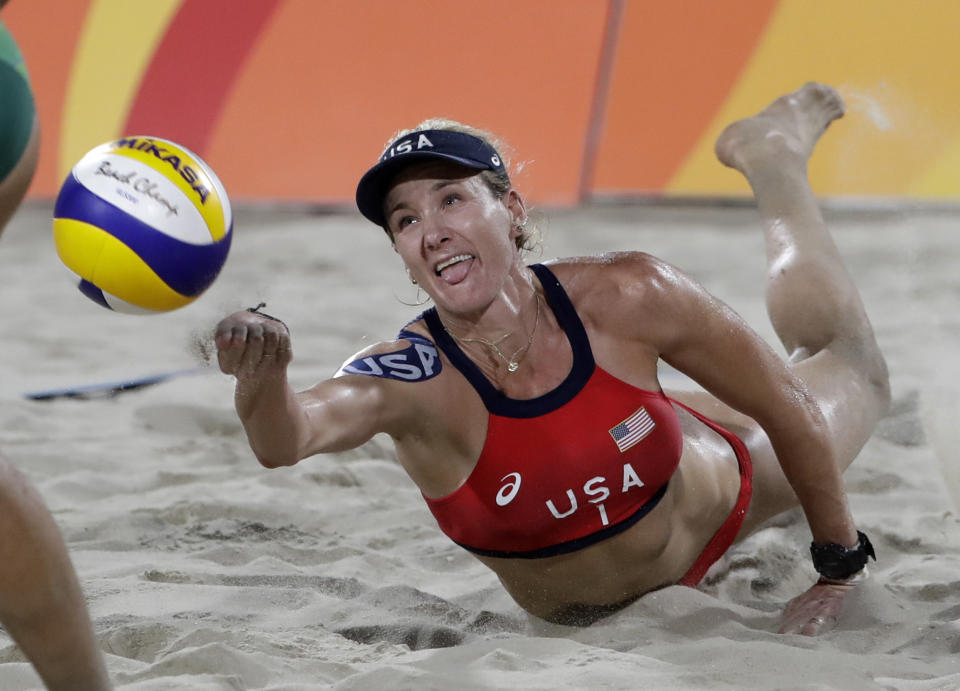 Kerri Walsh Jennings digs for a ball while playing Brazil during the women's beach volleyball bronze medal match of the Summer Olympics in Rio de Janeiro, Brazil. During the coronavirus pandemic, beach volleyball star Walsh Jennings has been doing online talks with young volleyball players, including one with the team at her alma mater of Archbishop Mitty H.S. in California. (AP Photo/Marcio Jose Sanchez, File)