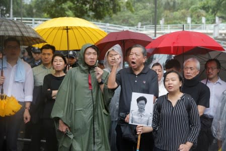 Pro-democracy legislators speak to the media demanding the Hong Kong Chief Executive Carrie Lam withdraw a controversial extradition bill outside Government House in Hong Kong