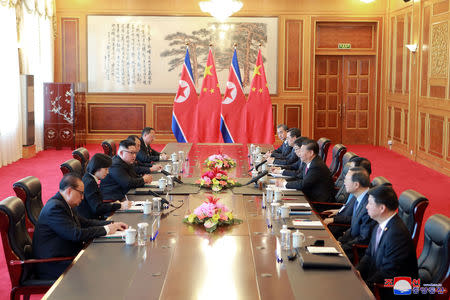 North Korean leader Kim Jong Un and China's President Xi Jinping hold a meeting in Dalian, China in this undated photo released on May 9, 2018 by North Korea's Korean Central News Agency (KCNA). KCNA/via REUTERS/Files