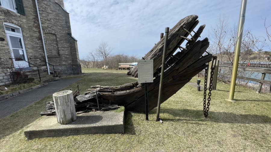 A 12-foot section of a shipwrecked schooner sits outside the White River Light.