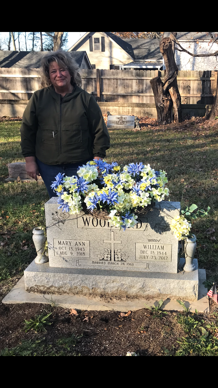Sue Faulk at her parents' grave.