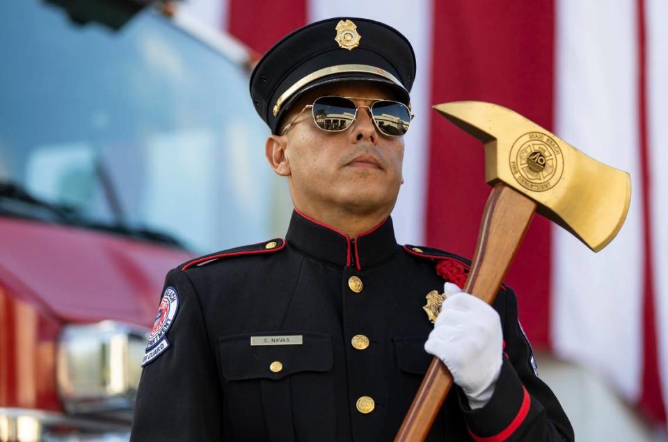 Claudio Navas, a Miami Beach Fire Department Fire Investigator and a member of the honor guard, attends a September 11, 2001, remembrance ceremony at Fire Station 2 on Monday, Sept. 11, 2023, in Miami Beach, Fla.
