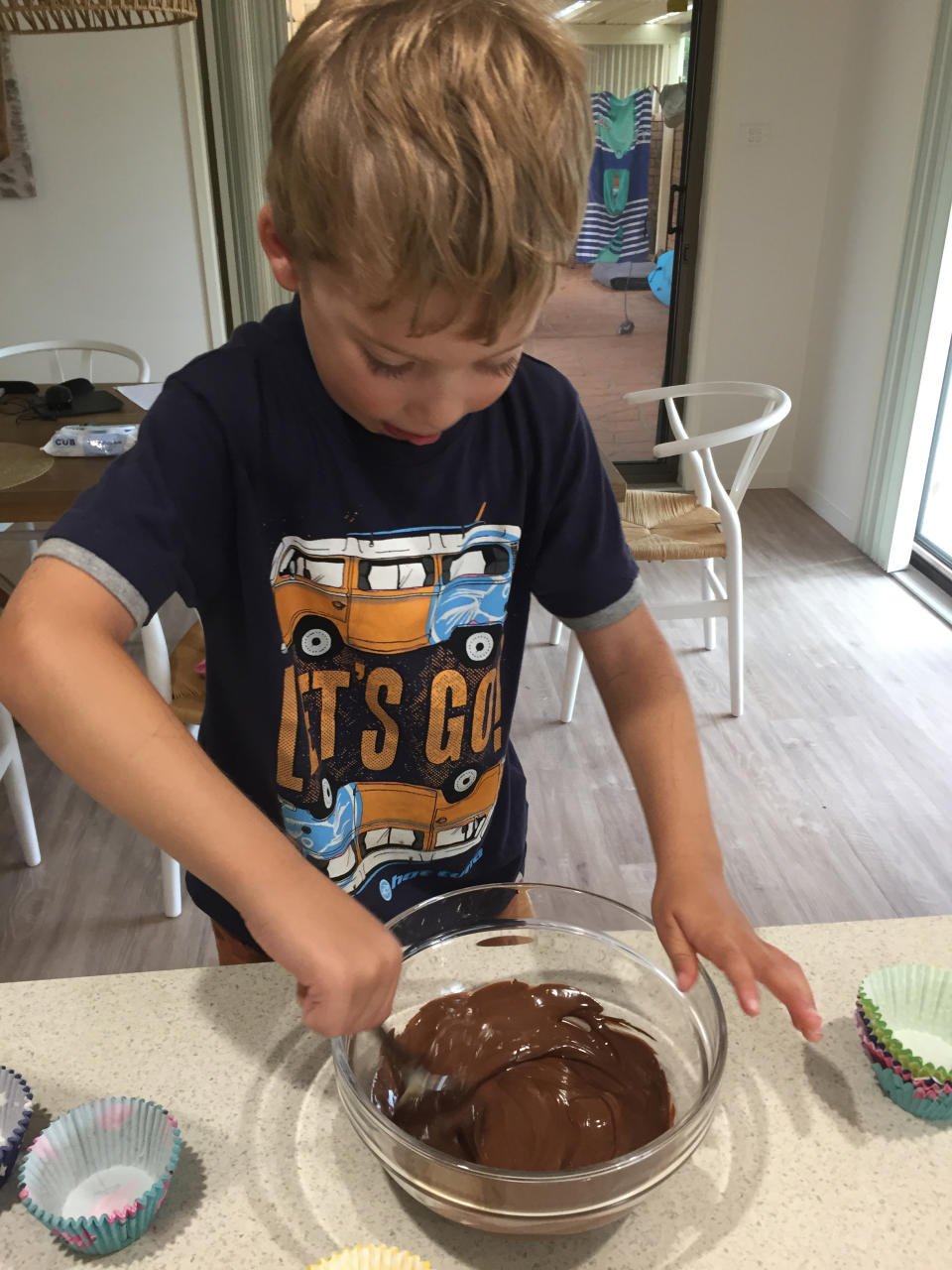 Young boy making a chocolate cake