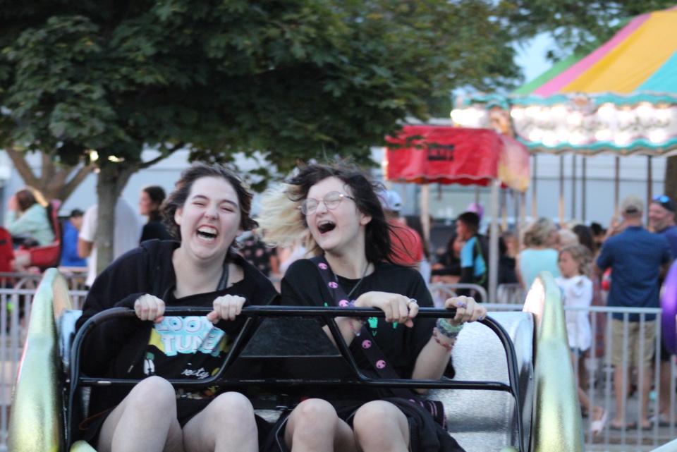 People enjoy a a carnival ride at the Venetian Festival in Charlevoix on Saturday, July 22.